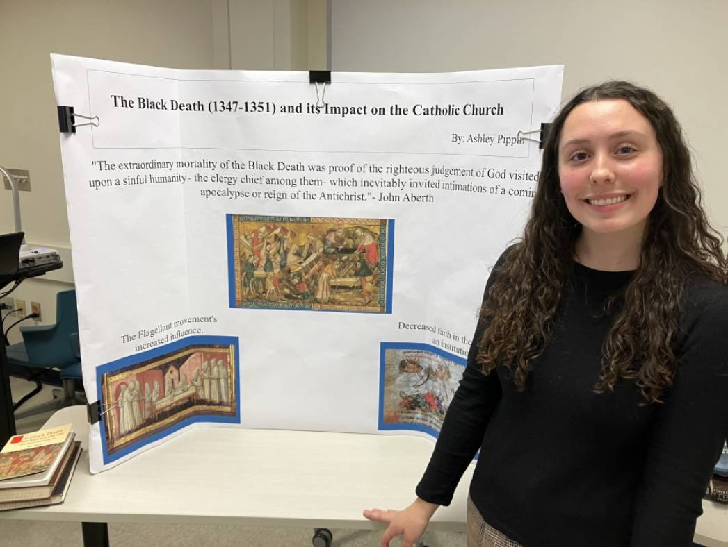 Ashley Pippin Standing by her Presentation